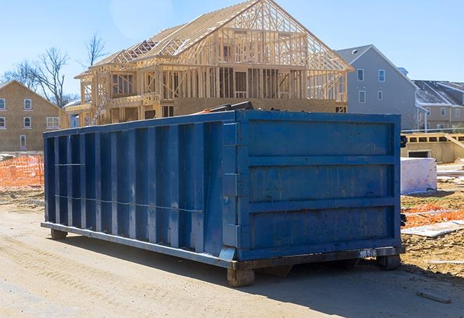 dumpsters placed outside an apartment complex